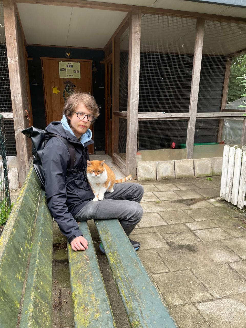 Alex with a cat on his lap